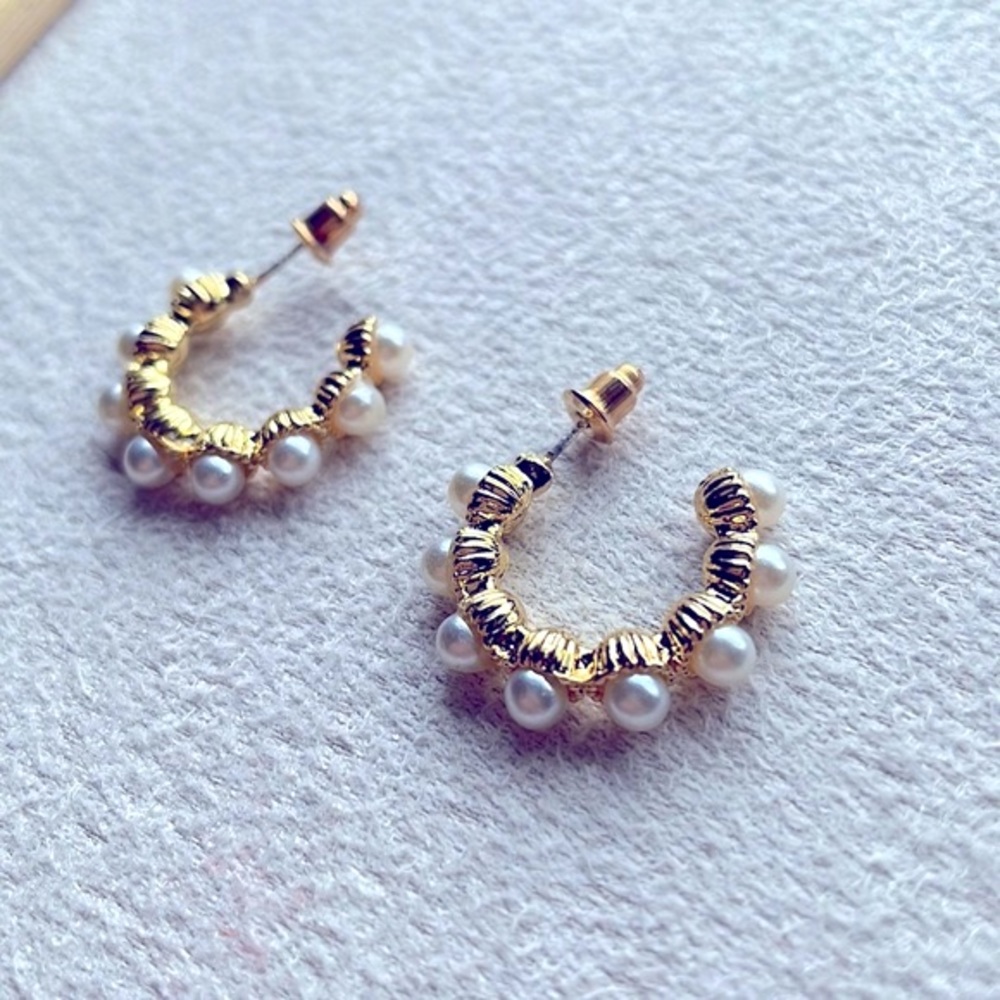 Pearls on open hoop earrings